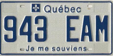 Canadian license plate that says "Quebec" at the top and "Je me souviens" at the bottom.