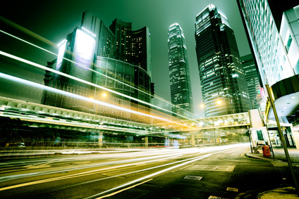 Long exposure image of a city street with blurred headlights.