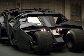 An advanced black car that resembles the "Bat mobile."