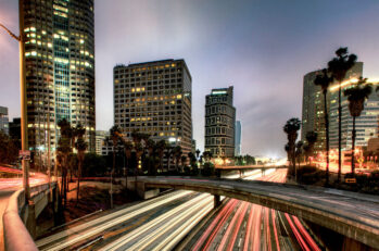 Long exposure image of a highway with blurred lights from cars.