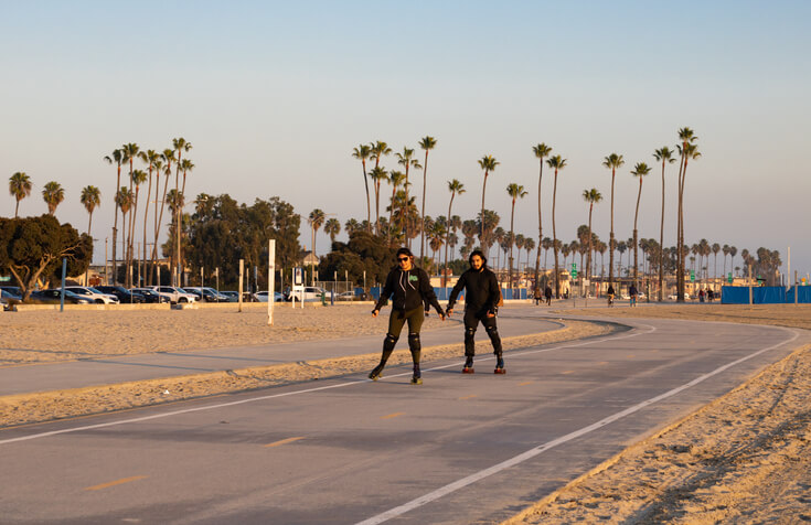 Long Beach, CA USA - street view of people exercising in long beach in the golden hour