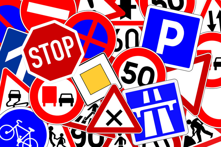 Many colorful traffic signs