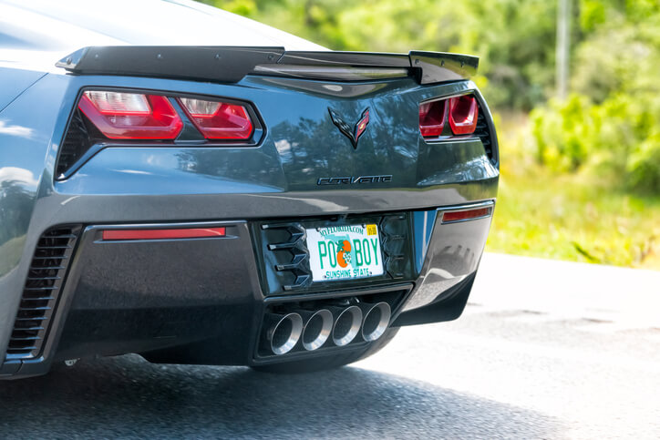 Closeup of corvette luxury car driving in Mississippi with a Florida license plate.
